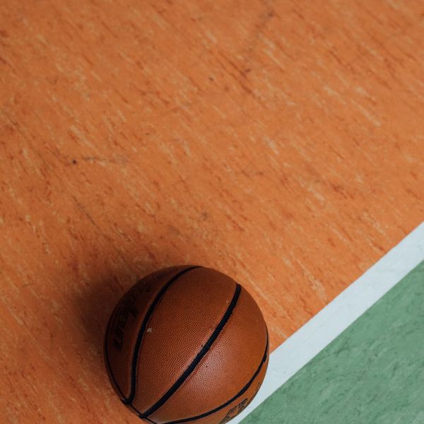 Close up of sports equipment on a textured floor.